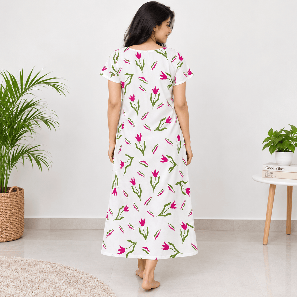 Back view of women's floral printed white nighty with pink and green floral print